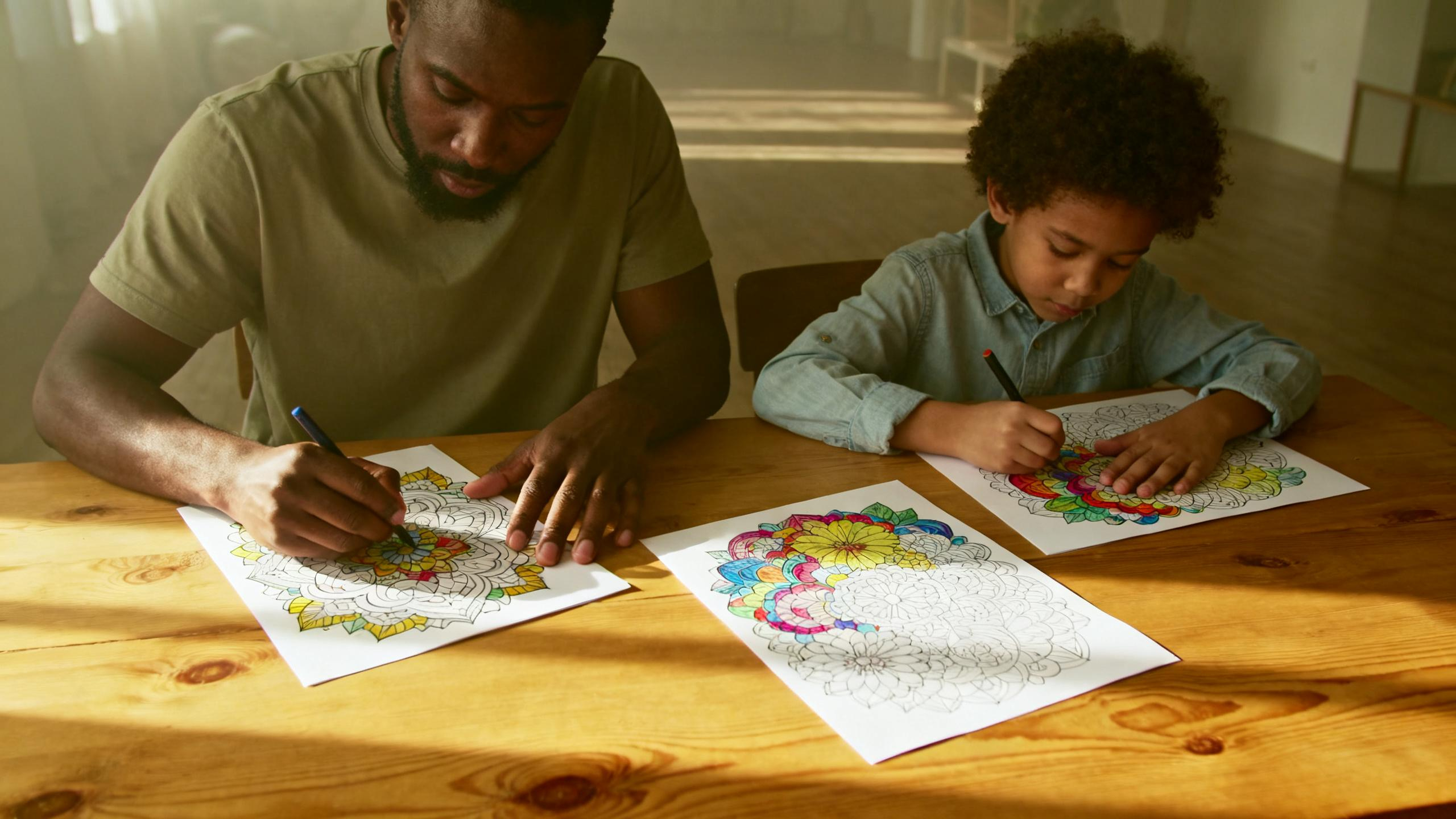 Various coloring pages and art supplies on a table